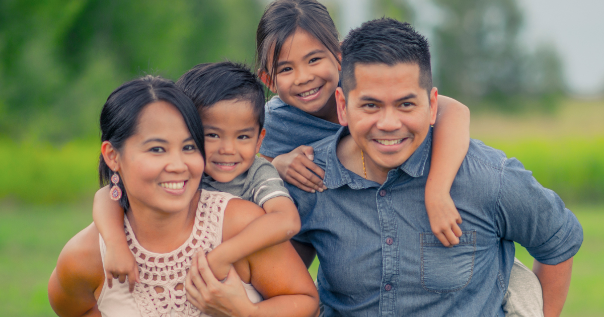 Smiling family after receiving dental care at Higher Ground Dentistry