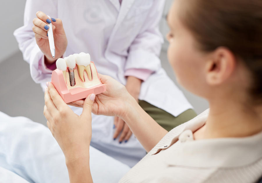 Dentist explaining dental implant procedure to patient